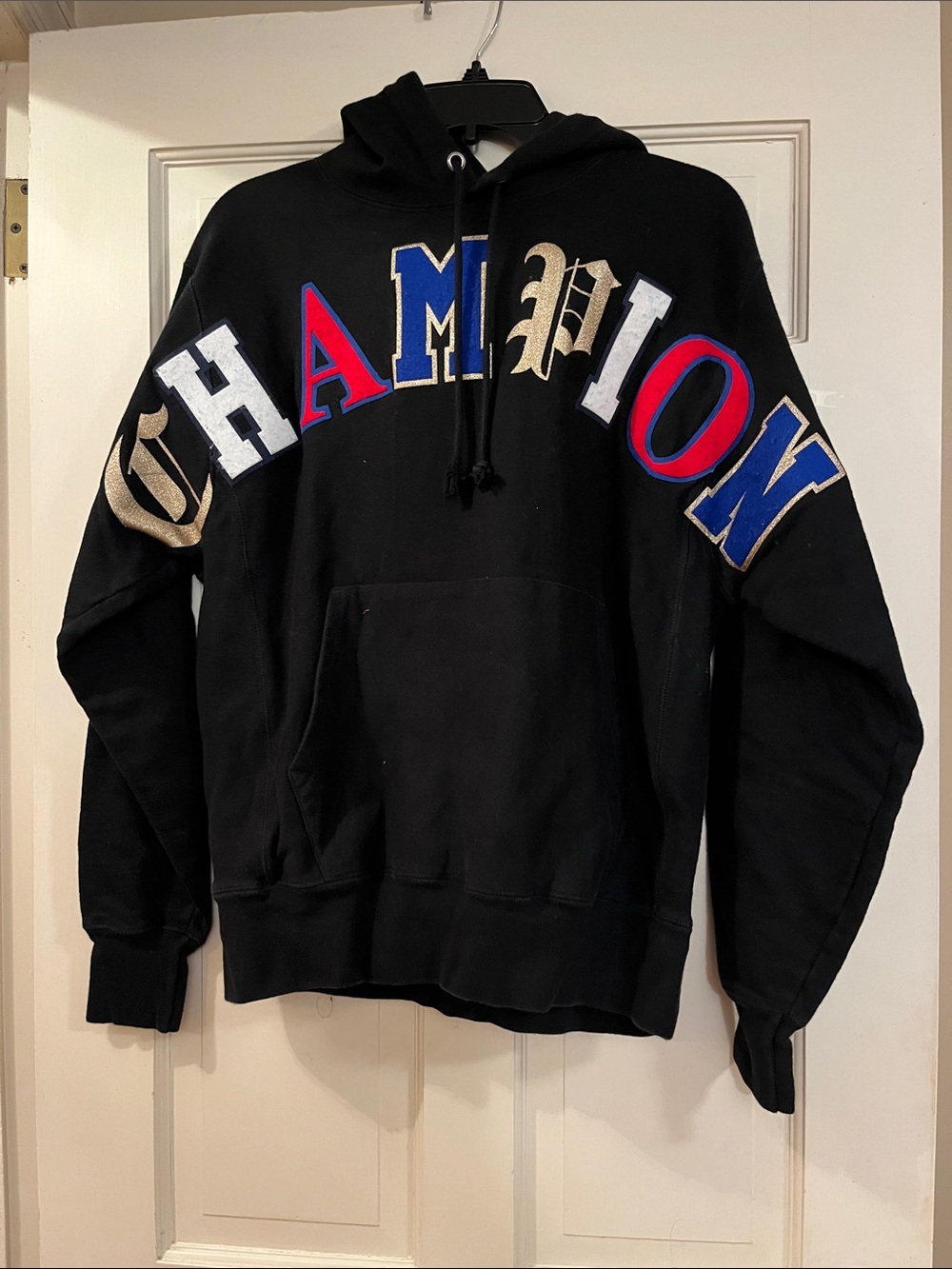 Champion Black Hoodie with Multicolor Appliqué